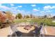 Community fire pit surrounded by benches, set against a backdrop of manicured lawns and inviting neighborhood homes at 6041 N Orleans St, Aurora, CO 80019