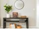 Living room console table featuring a green plant and vintage record player at 6041 N Orleans St, Aurora, CO 80019