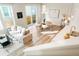 Sunlit living area with dining space, modern kitchen, and sliding glass door for indoor-outdoor living at 6041 N Orleans St, Aurora, CO 80019