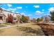 Charming street view showcasing well-maintained homes, sidewalks, and beautifully landscaped common areas with trees at 6041 N Orleans St, Aurora, CO 80019