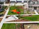 Aerial view of community space with seating under a modern shade structure, surrounded by lush landscaping at 6041 N Orleans St, Aurora, CO 80019
