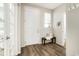 Bright entryway with a stylish bench, natural light, and view into the house at 6041 N Orleans St, Aurora, CO 80019