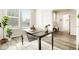 Inviting home office featuring a contemporary desk, comfortable chair, and natural light at 6041 N Orleans St, Aurora, CO 80019