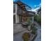 Backyard features a cozy lounge area with fire pit, lush greenery, and modern architectural design at 1175 S Jackson St, Denver, CO 80210