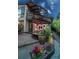 Gorgeous backyard with patio, outdoor fireplace, and beautiful landscaping for ultimate relaxation at 1175 S Jackson St, Denver, CO 80210