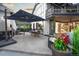 Spacious backyard patio with umbrella, barbeque, outdoor dining, and well maintained landscaping at 1175 S Jackson St, Denver, CO 80210