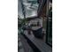 Modern deck with outdoor seating with views of the built-in BBQ area and well-manicured backyard at 1175 S Jackson St, Denver, CO 80210