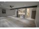 Open basement living area with custom bar, wood flooring, and modern finishes at 1175 S Jackson St, Denver, CO 80210