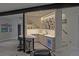 Finished basement wet bar features custom lighting, modern finishes, beverage fridge and plenty of room for seating at 1175 S Jackson St, Denver, CO 80210