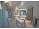 Open primary bathroom boasts a walk-in shower, sleek vanity, and unique island at 1175 S Jackson St, Denver, CO 80210