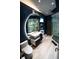 Bathroom featuring a circular mirror, modern vanity and separate shower at 1175 S Jackson St, Denver, CO 80210