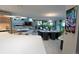 Bright open-concept space with modern kitchen and dining, seamlessly connecting to a cozy living area with outdoor access at 1175 S Jackson St, Denver, CO 80210