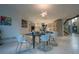 Bright dining room with modern decor and views into the kitchen, creating an inviting living space at 1175 S Jackson St, Denver, CO 80210