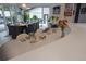 Well-lit dining area showcasing elegant table setting, access to the open-concept kitchen, and seamless flow to other areas at 1175 S Jackson St, Denver, CO 80210
