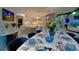 Well-lit dining room showcasing modern décor, connecting seamlessly to a sleek kitchen and inviting living spaces at 1175 S Jackson St, Denver, CO 80210
