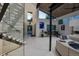Bright foyer with a modern staircase, high ceilings, and a view into the contemporary living space at 1175 S Jackson St, Denver, CO 80210