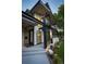 Charming entry to this modern home with black trim, stylish landscaping, and a covered balcony at 1175 S Jackson St, Denver, CO 80210