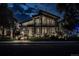 Modern home at night featuring dramatic architecture and enhanced landscaping for a striking nighttime curb appeal at 1175 S Jackson St, Denver, CO 80210