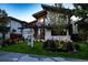 Beautifully landscaped front yard and modern architectural details of this home give it a striking curb appeal at 1175 S Jackson St, Denver, CO 80210