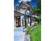 Well-maintained front yard and modern exterior design with unique architectural elements and landscaping at 1175 S Jackson St, Denver, CO 80210