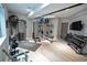 Home gym featuring weights, machines, mirrors and other fitness equipment at 1175 S Jackson St, Denver, CO 80210