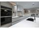 Sleek kitchen showcasing integrated appliances, custom cabinets, and modern fixtures at 1175 S Jackson St, Denver, CO 80210
