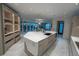 Kitchen with spacious island, modern appliances, and stone floors at 1175 S Jackson St, Denver, CO 80210