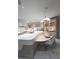 Modern kitchen featuring a large island with bar seating, sleek countertops, and ample cabinet space at 1175 S Jackson St, Denver, CO 80210