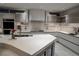Spacious kitchen featuring modern appliances, sleek cabinetry, and stone floors at 1175 S Jackson St, Denver, CO 80210