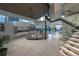 Spacious living room with modern fireplace, glass staircase, and comfortable seating, perfect for entertaining at 1175 S Jackson St, Denver, CO 80210