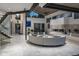 Open living area with a contemporary fireplace, stylish furniture, and seamless indoor-outdoor flow at 1175 S Jackson St, Denver, CO 80210