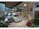 Bright living room boasting high ceilings, modern staircase, ample natural light, and stylish contemporary design at 1175 S Jackson St, Denver, CO 80210