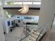 Modern home interior with unique lighting fixture, sleek staircase, and a view of the spacious living area at 1175 S Jackson St, Denver, CO 80210