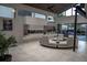 Open-concept living room with modern fireplace, expansive windows, and a sleek, curved sofa set at 1175 S Jackson St, Denver, CO 80210