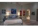 Bright main bedroom with hardwood floors, tray ceiling, modern decor and an ensuite bath at 1175 S Jackson St, Denver, CO 80210