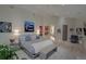 Bright main bedroom with hardwood floors, tray ceiling, modern decor and an ensuite bath at 1175 S Jackson St, Denver, CO 80210