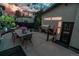 Backyard dining area with BBQ and modern outdoor furniture perfect for entertaining guests at 1175 S Jackson St, Denver, CO 80210