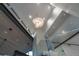 Modern staircase with glass railings and custom lighting showcasing the architectural details at 1175 S Jackson St, Denver, CO 80210