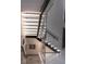 Modern staircase featuring glass railings and unique lighting at 1175 S Jackson St, Denver, CO 80210