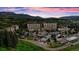 Beautiful aerial view of property with mountain backdrop and treed surroundings at 611 Village Rd # 620, Breckenridge, CO 80424