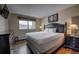 Comfortable bedroom featuring a king bed, dark wood floors, and a window with a scenic view at 611 Village Rd # 620, Breckenridge, CO 80424