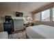 Comfortable bedroom with desk area, dresser, mini-fridge, microwave and a scenic window view at 611 Village Rd # 620, Breckenridge, CO 80424