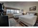 Cozy bedroom offers two queen beds, a well-lit desk area, and laminate flooring at 611 Village Rd # 620, Breckenridge, CO 80424
