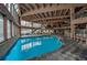 Indoor pool with spacious seating area and large windows providing lots of natural light at 611 Village Rd # 620, Breckenridge, CO 80424