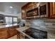 Updated kitchen features granite countertops, stainless steel appliances and wood cabinets at 611 Village Rd # 620, Breckenridge, CO 80424
