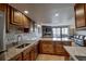 Gourmet kitchen with stone countertops, stainless steel appliances, and a view of the living room at 611 Village Rd # 620, Breckenridge, CO 80424
