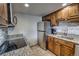 Well-equipped kitchen with stone countertops, stainless steel appliances and natural wood cabinets at 611 Village Rd # 620, Breckenridge, CO 80424