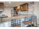 Stylish kitchen with stainless steel appliances, stone countertops and breakfast bar seating at 611 Village Rd # 620, Breckenridge, CO 80424