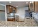 Modern kitchen featuring stainless steel appliances, stone countertops, and hardwood floors at 611 Village Rd # 620, Breckenridge, CO 80424
