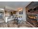 Open concept living room with a fireplace, tv, breakfast bar, and kitchen in the background at 611 Village Rd # 620, Breckenridge, CO 80424